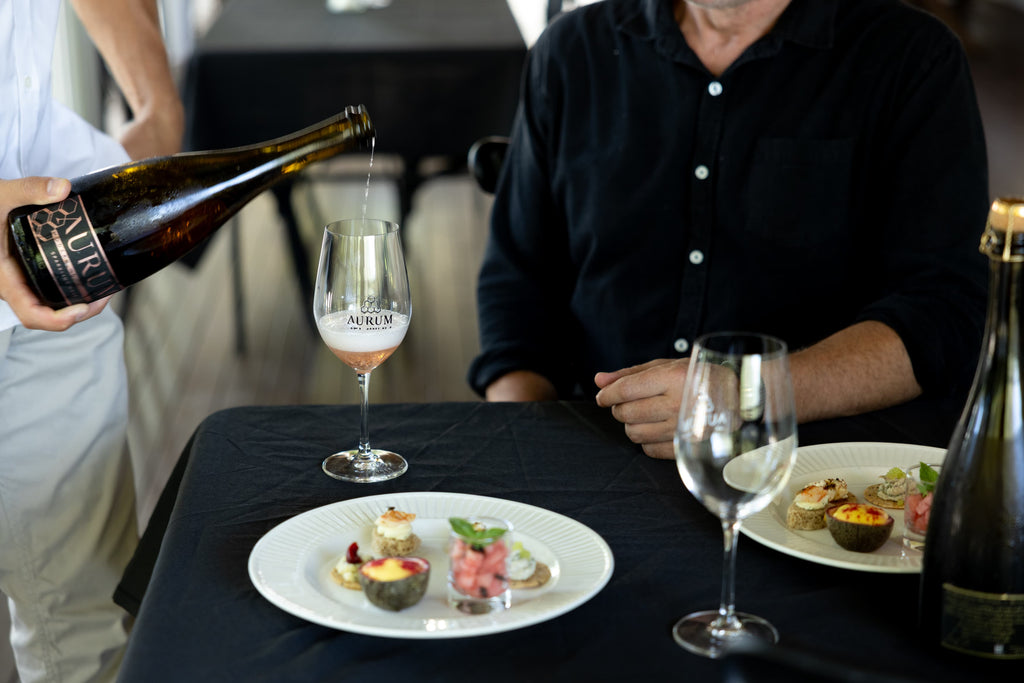 AURUM cellar door tasting setup with wine glasses at Newrybar Hall