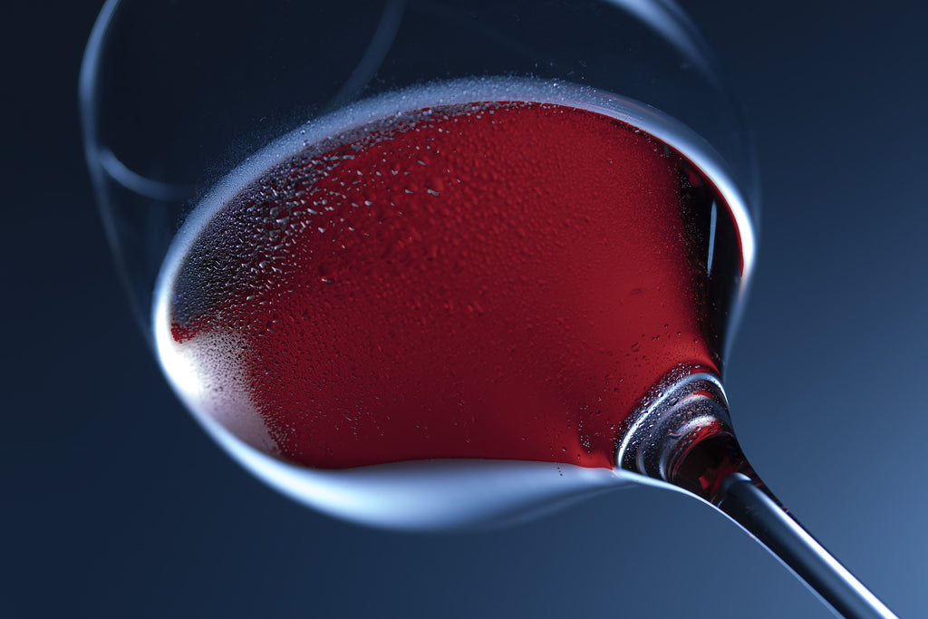 A glass of Aurum ruby red Manuka honey wine