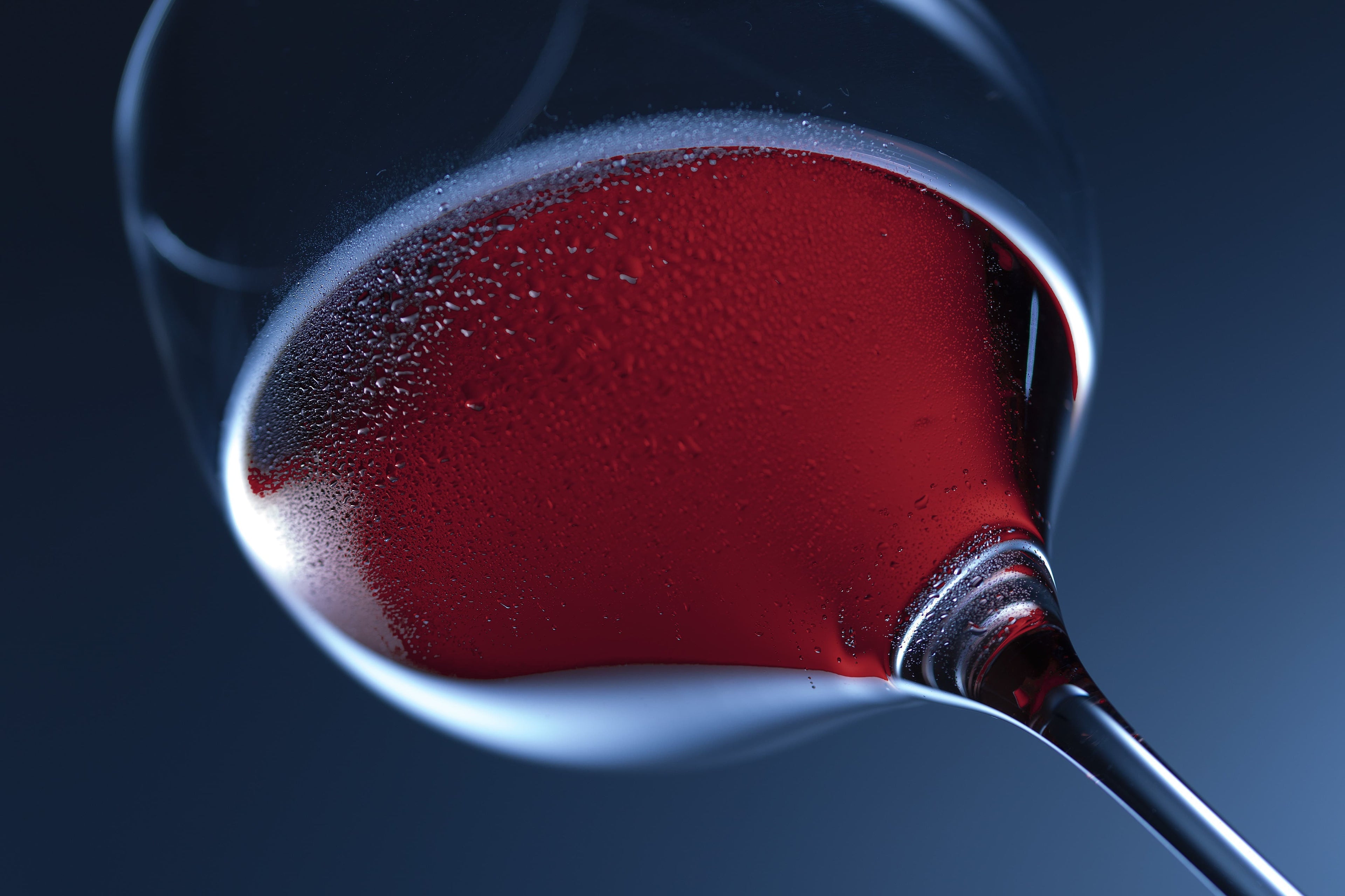 A glass of Aurum ruby red Manuka honey wine