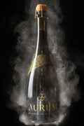 A bottle of AURUM vintage Sparkling Rose first release with smoke